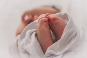 Hands holding a newborn baby